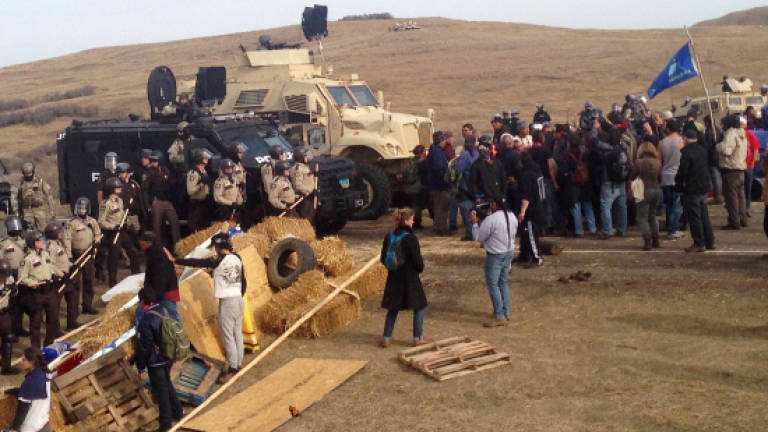 North Dakota police arrest pipeline protesters