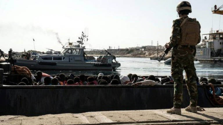 Merkel backs Libyan coastguard but warns against abuses