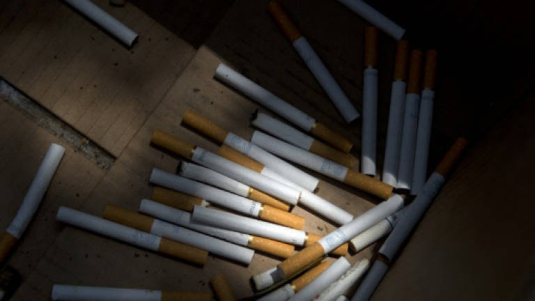 Two cops held over illegal cigarettes