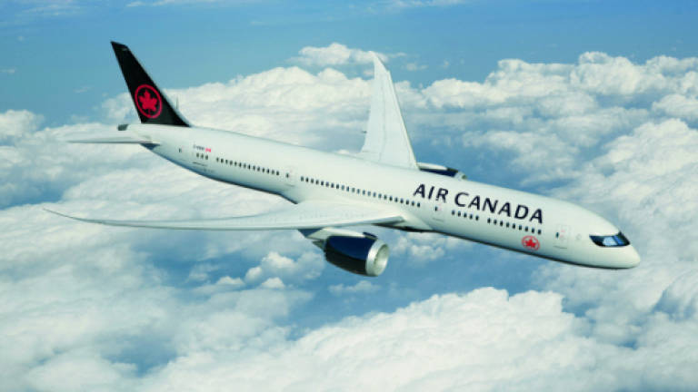 Air Canada unveils new looks for staff and fleet
