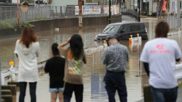 Twenty dead as record Japan rains prompt mass evacuations