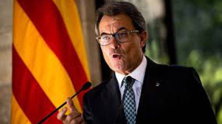 Catalan president warns Spain attack suspect still at large