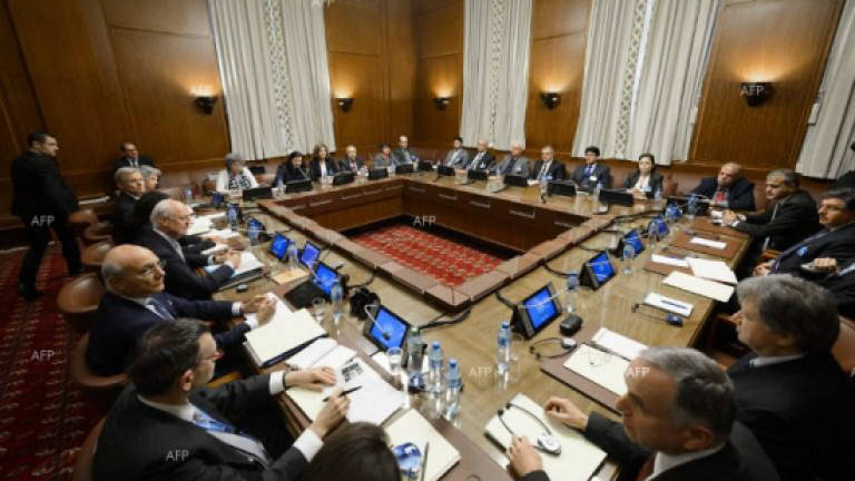 Syrian opposition agrees to send united delegation to Geneva talks