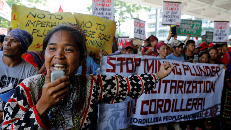 Protesters storm Philippines mining event, demand halt to extraction