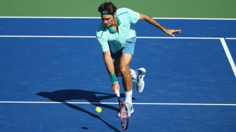 Federer advances with milestone Masters match win