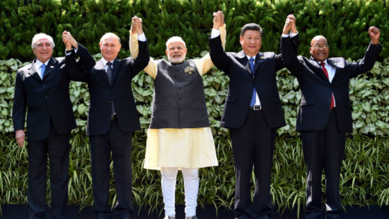 Modi hosts BRICS leaders amid bloc's economic woes