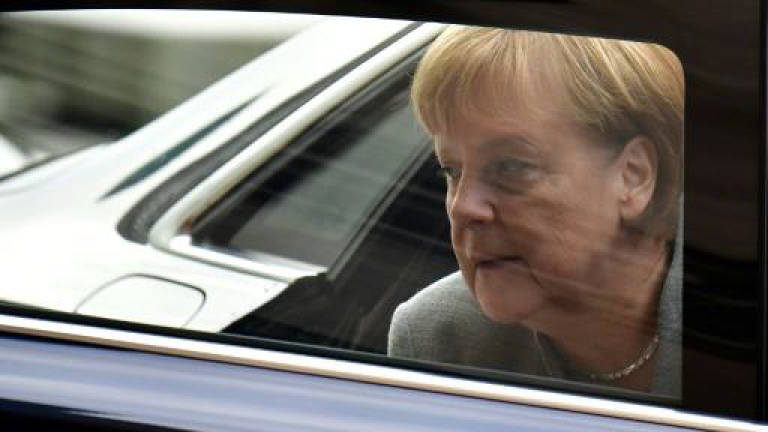 Merkel, Macron to front diplomatic push at UN climate talks