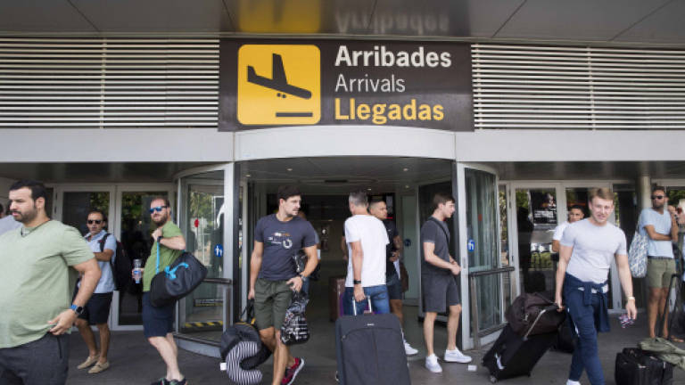Packed with tourists, Ibiza struggles to house locals
