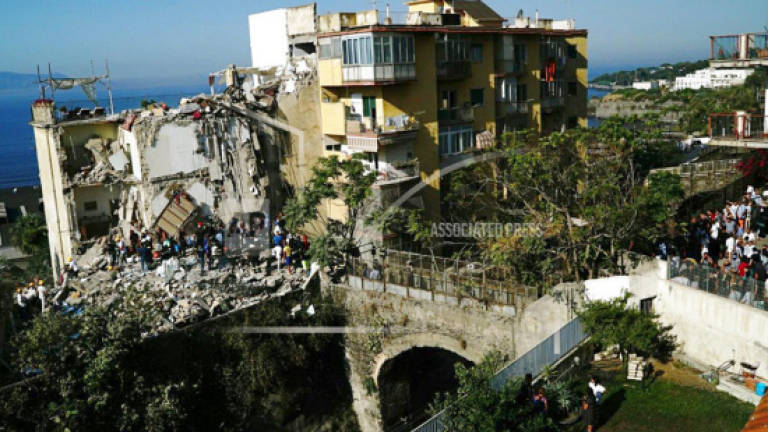 Apartment building collapses in Italy; some may be trapped