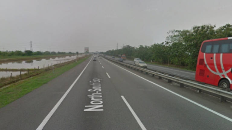 Passer-by dies while crossing highway to check on accident
