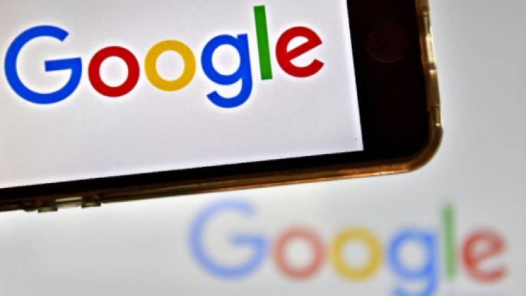 Alphabet profit hit by EU fine on Google