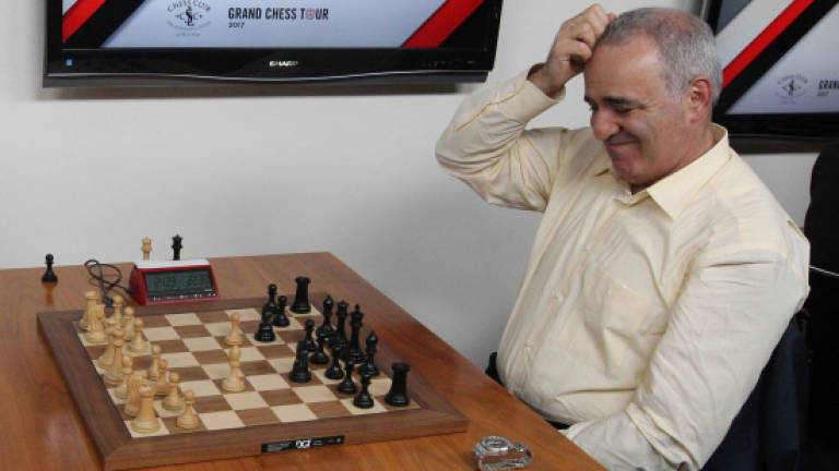 Kasparov notches first win in brief return to chess