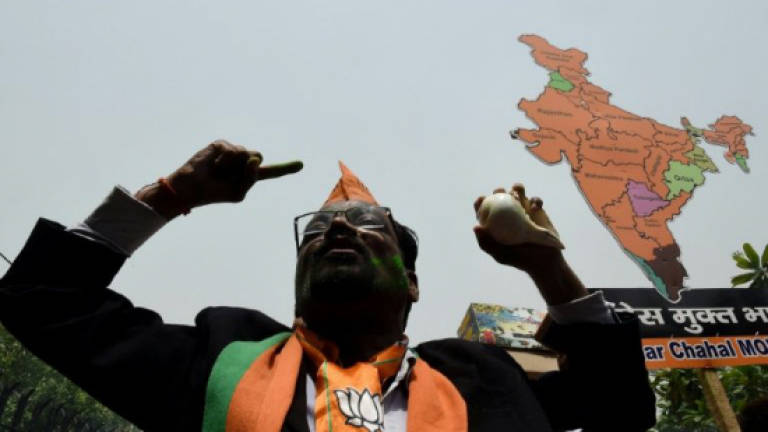 India's Congress scrambles to block Modi party in key state