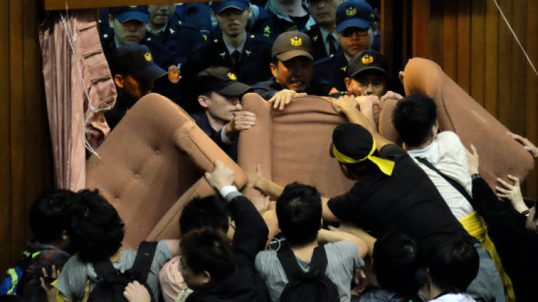 Taiwan protesters occupy parliament over China trade pact