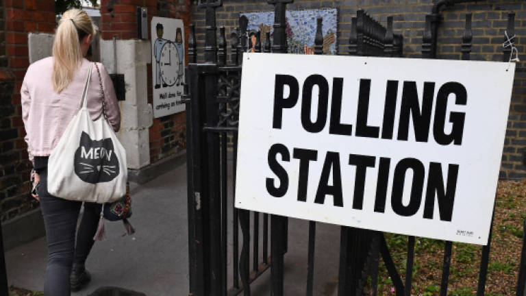 In shadow of terror, British election tighter than expected