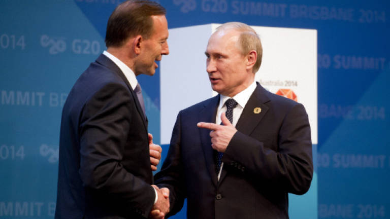 Putin to cut short G20 summit after rebukes over Ukraine
