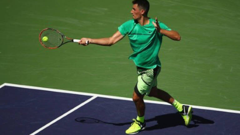Tomic pulls out at Miami with back injury