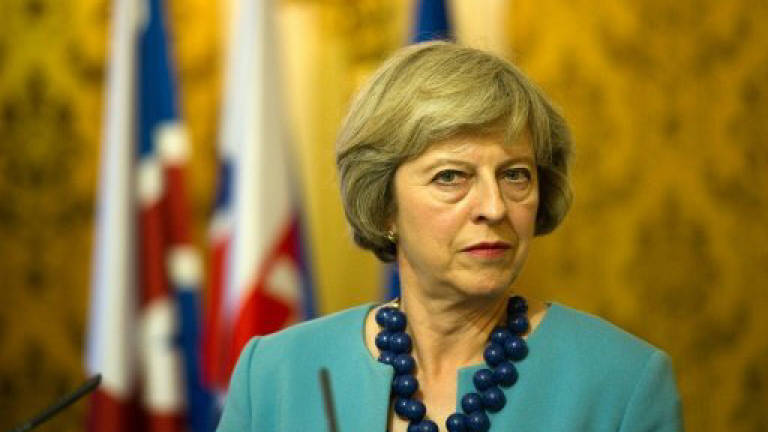 British PM seeks to reassure Poles, Slovaks in UK post-Brexit
