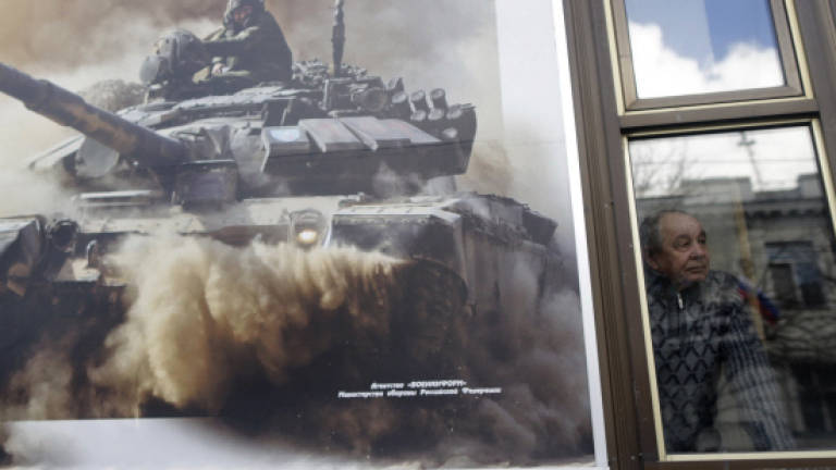 Ukraine, Moscow clash over rebel autonomy laws