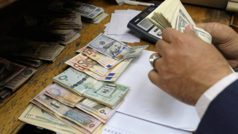 1,000 in money-laundering probe: Report