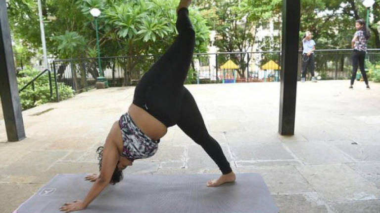 The Indian woman defying body stereotypes through yoga