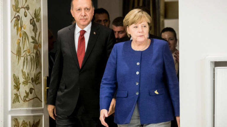 Merkel says Turkey must not 'misuse' Interpol in writer's case
