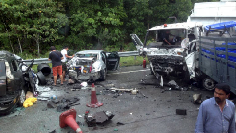 Two killed, 14 hurt in eight-vehicle crash