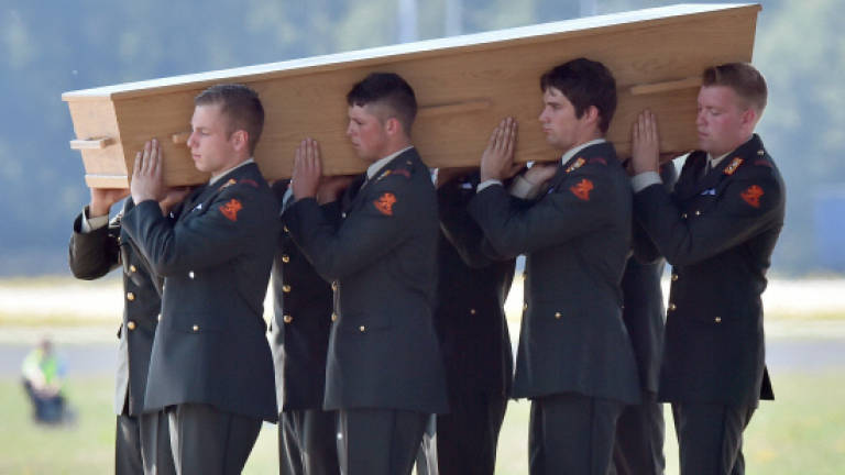'This is how to honour the dead': Dutch papers on MH17 grief