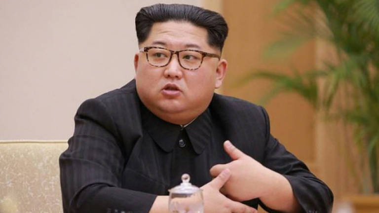 N. Korea parliament meets but Kim absent ahead of summits
