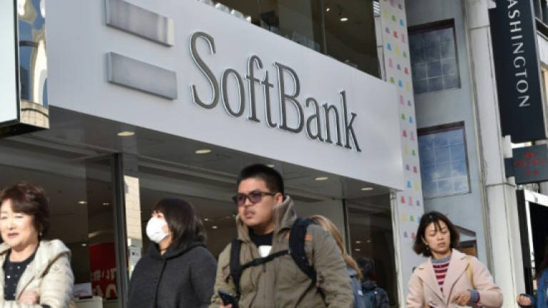 SoftBank seals deal for large Uber stake, trimming valuation