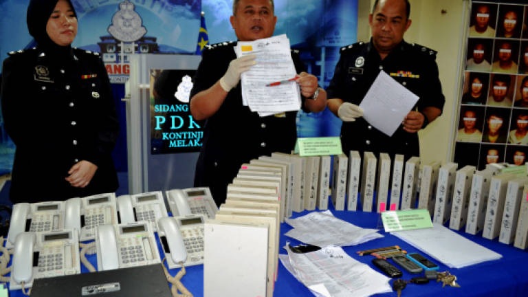 Malacca police nab 29 'Macau Scam' syndicate members