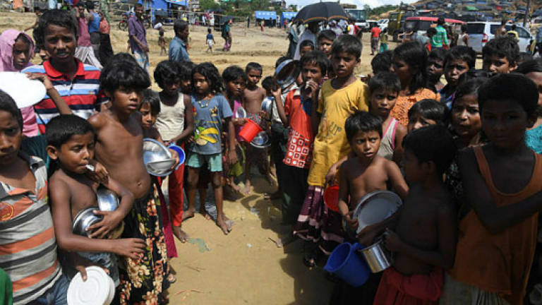 Bangladesh bans three charities from giving Rohingya aid