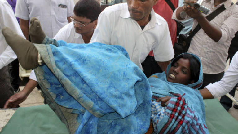 India police detain sterilisation surgeon after 13 women die