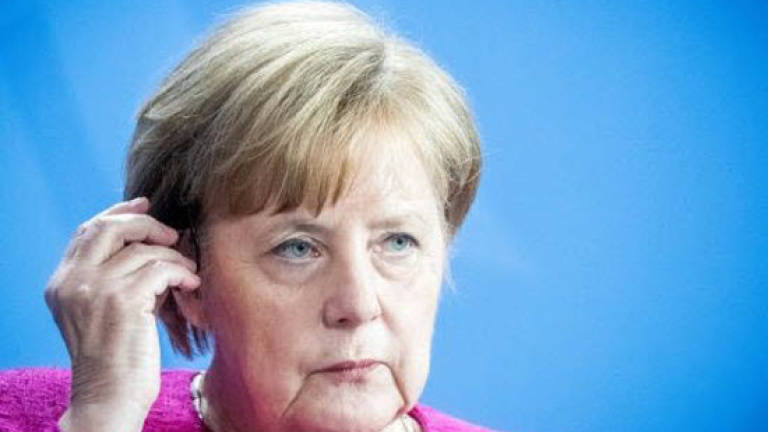 Hardline ally fires migrant ultimatum at Merkel as Trump wades in