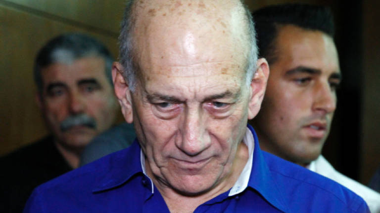 Ex-PM Olmert to begin prison term in a first for Israel