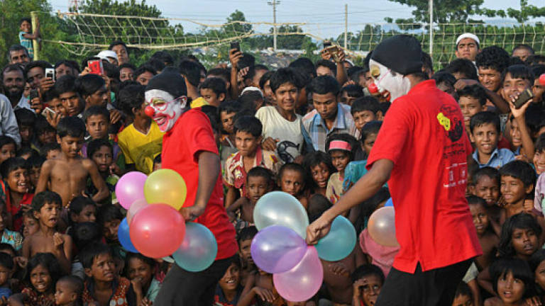 Clowns bring laughter to traumatised Rohingya children
