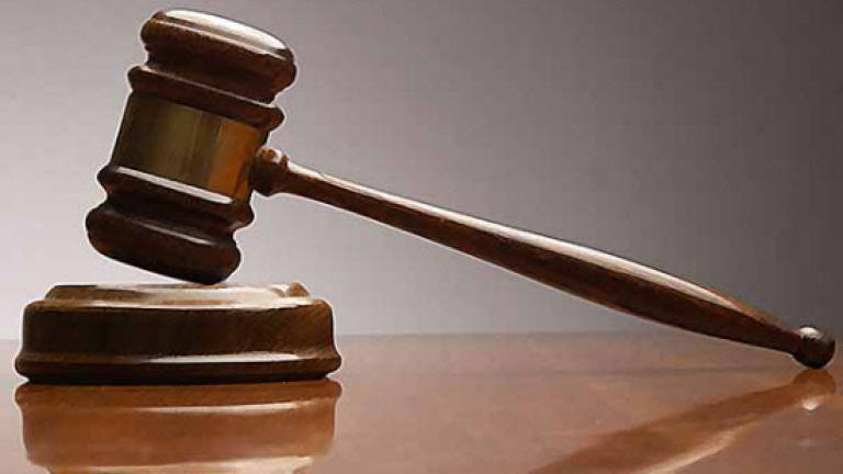 Textile trader claims trial to hurting wife
