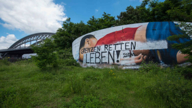 Mural for dead migrant boy vandalised in Germany