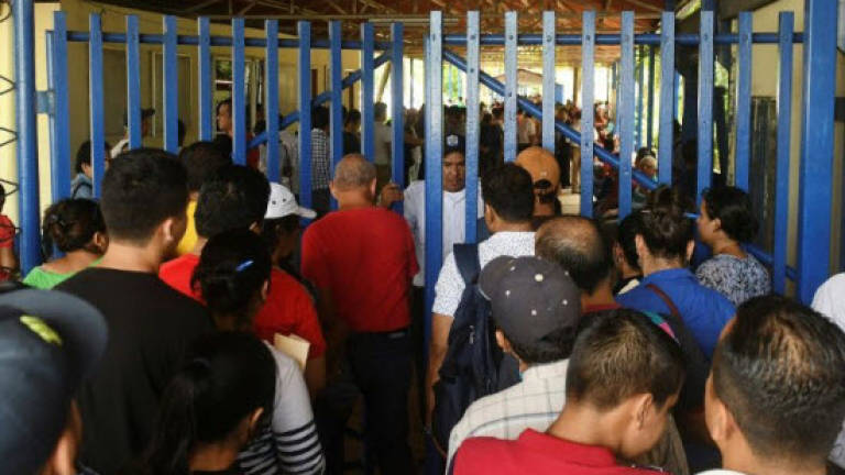 Nicaraguans flood migration offices in bid to flee crisis