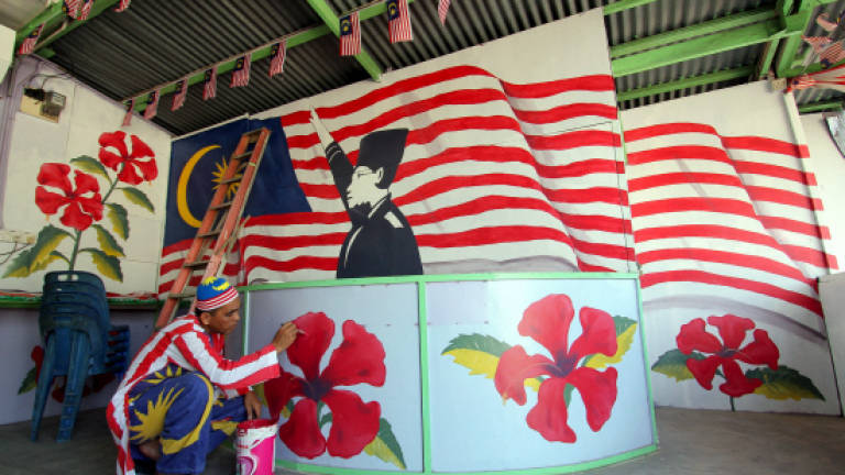 Eatery owner spends RM30,000 on National Day memorabilia
