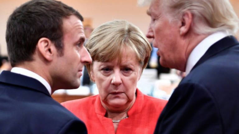 Macron outshines Merkel as EU's top diplomat