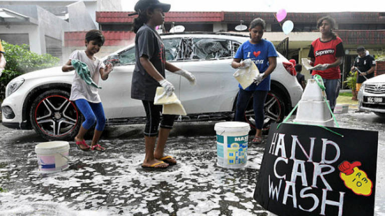 Car wash organised by children raises money for Tabung Harapan Malaysia