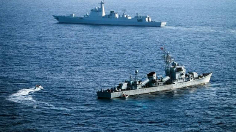 China protests after US warship sails near island
