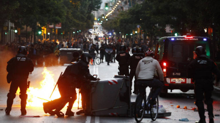 Protesters clash with police over Spain squat eviction