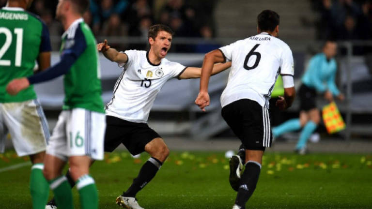 Germany down N.Ireland to extend perfect record