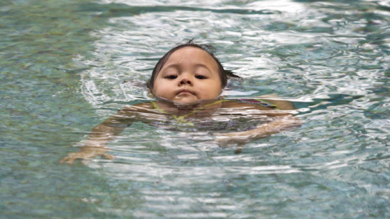 Toddler swims her way into record books