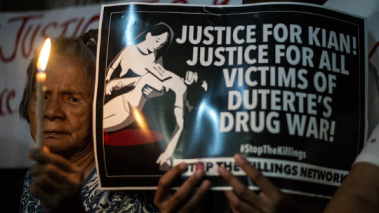 Thousands at boy's burial seek end to Philippine drug war