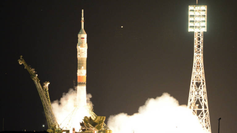 Soyuz rocket with three astronauts launches towards ISS after delay