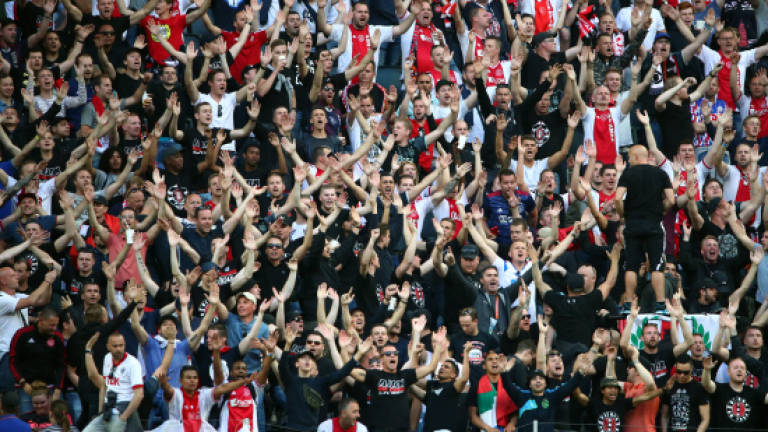 Manchester fans shaken but defiant ahead of Europe League final