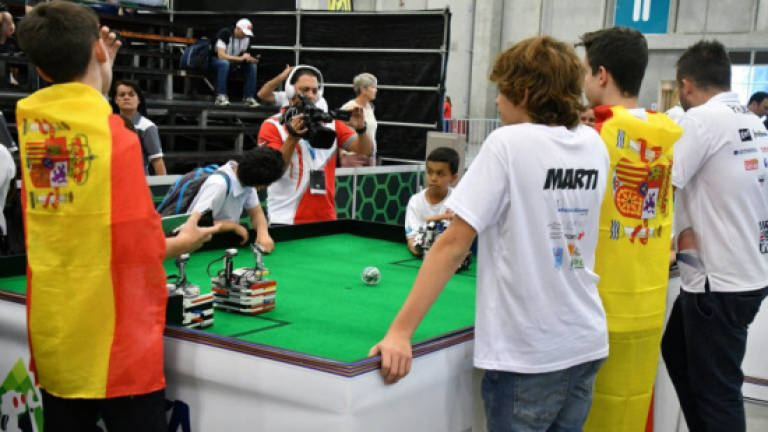 'Bots battle for the ball, and the globe, in Robot Olympiad